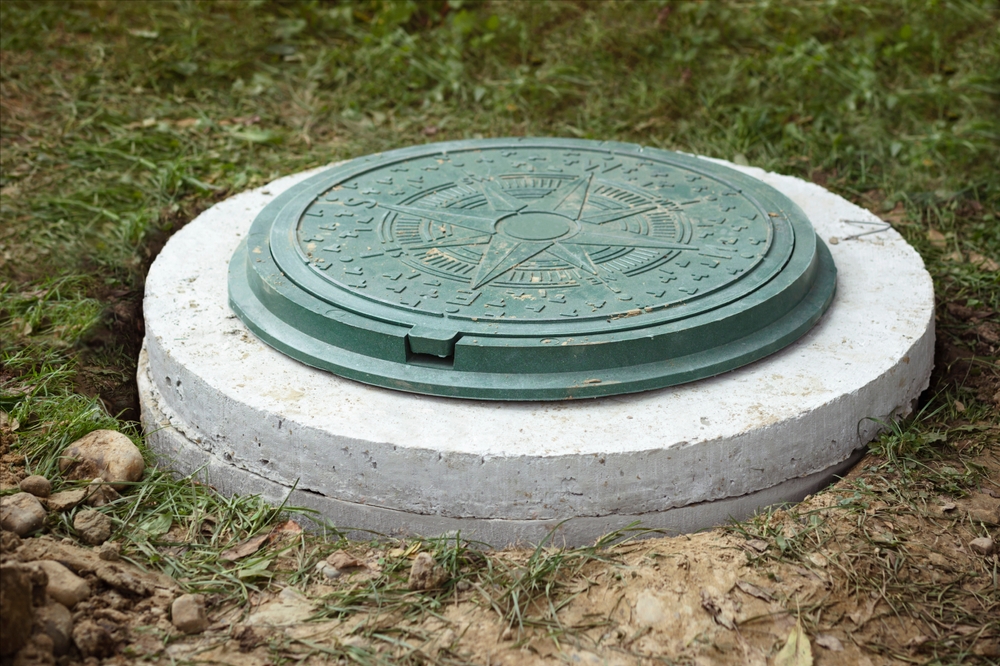 Sewer,manhole,on,septic,tank,made,of,concrete,rings.,construction